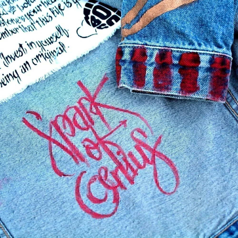Vintage faded denim classic jean jacket. Retro cut with hand painted images